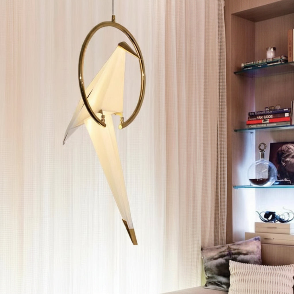 Gemelli Collections gold ring origami bird pendant lamp featuring a glowing geometric bird suspended inside a circular gold frame, modern luxury ceiling light for living rooms, dining rooms, bedrooms, and designer interiors.