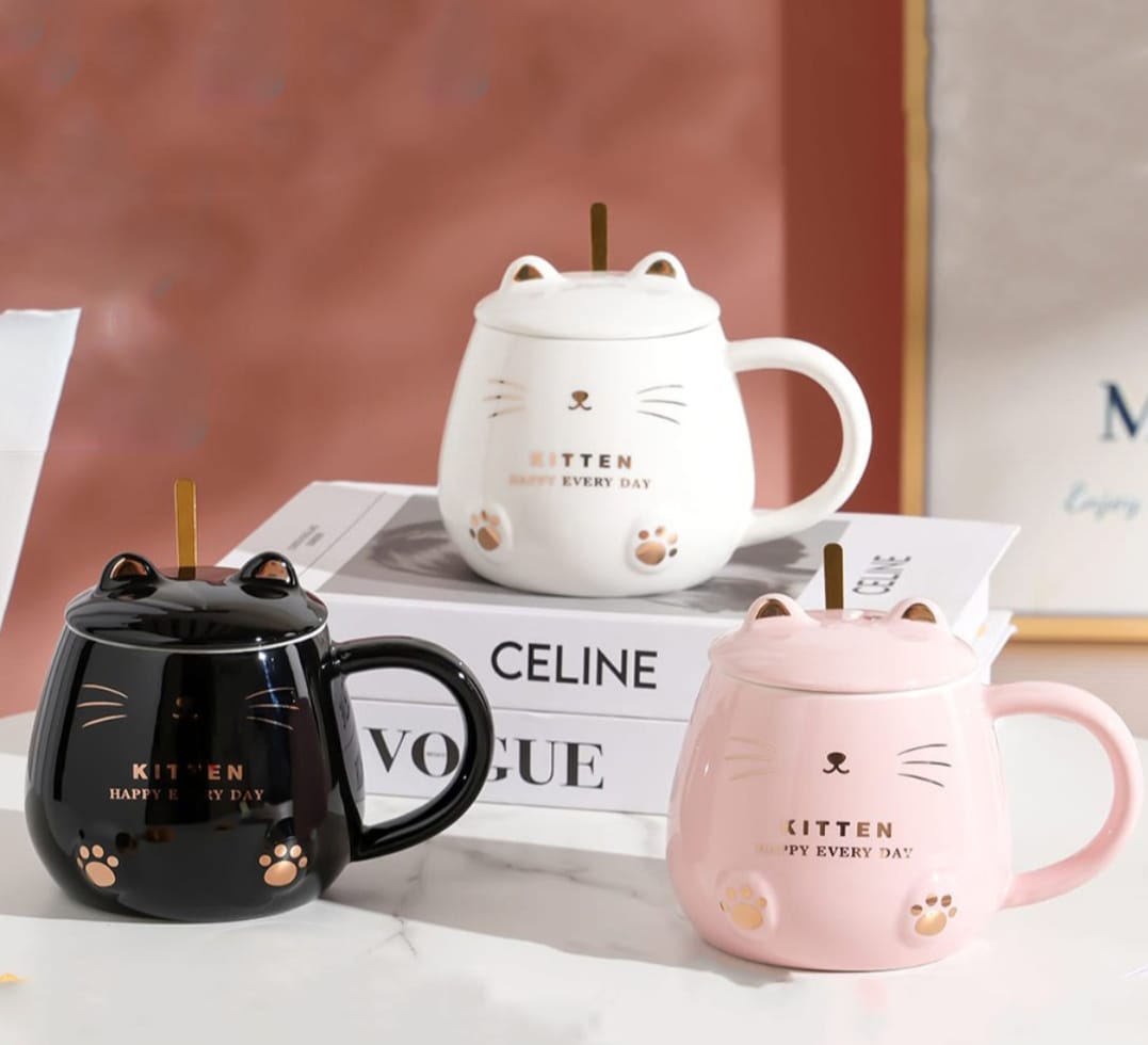 glossy kitten-themed coffee mug with matching lid and spoon cute cat design beverage cup available in black white and pink for coffee tea hot chocolate and everyday drinkware.