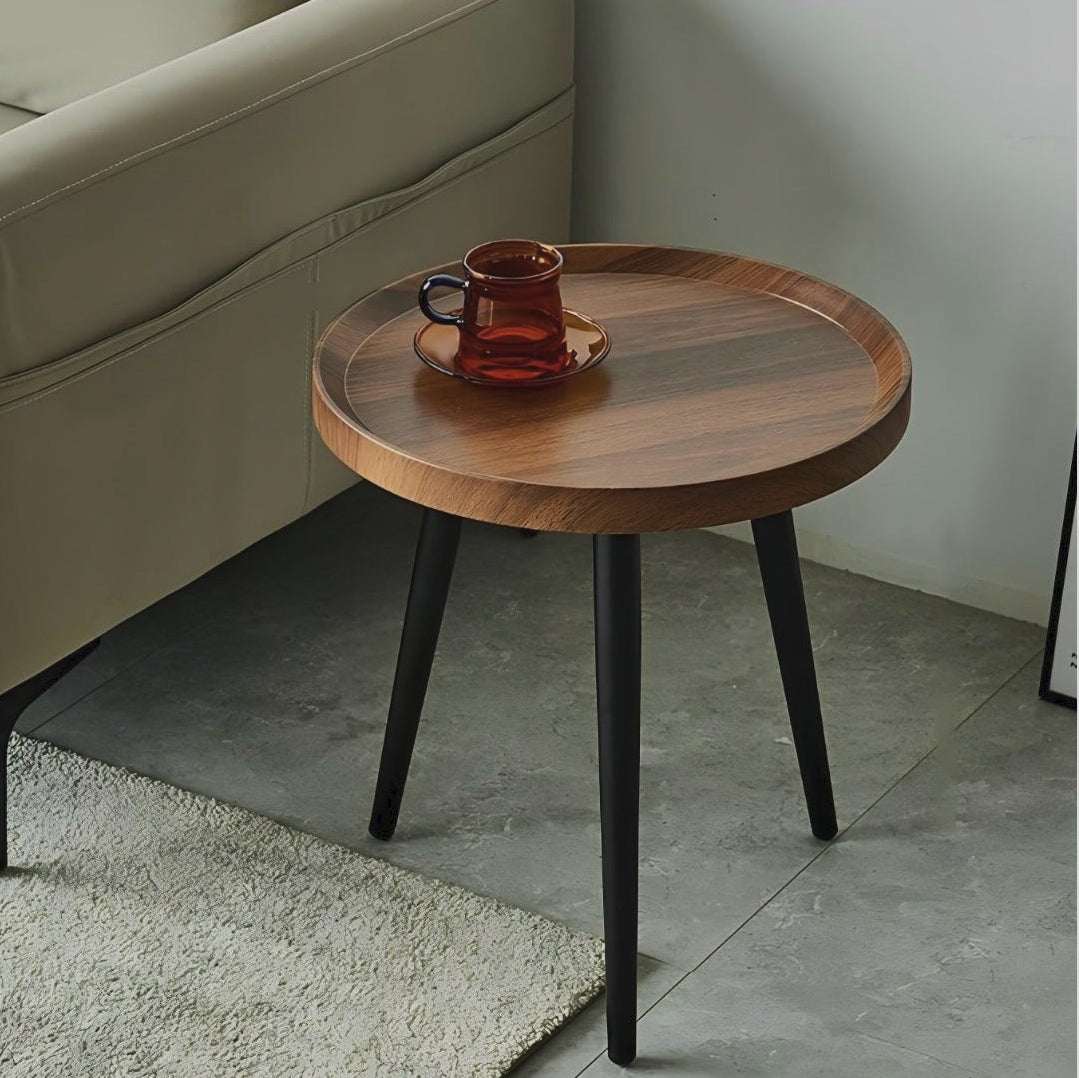 Round side stool with curved tabletop design measuring 40cm diameter for use as a bedside table accent table or decorative display stand.