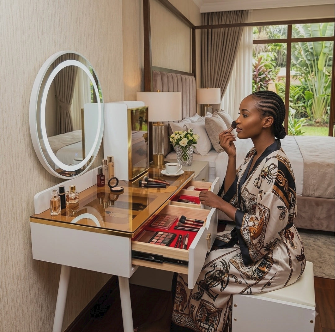 White and gold vanity dressing table set with amber glass top, round LED mirror, plush-lined drawers, glass display cabinet, and matching cushioned stool