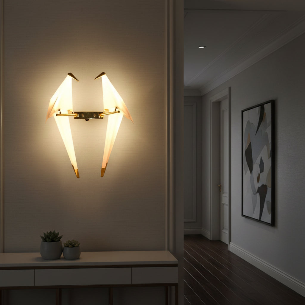 Gemelli Collections origami bird LED wall sconce with two geometric birds on a gold metal frame, warm white lighting, and modern decorative wall-mounted design.