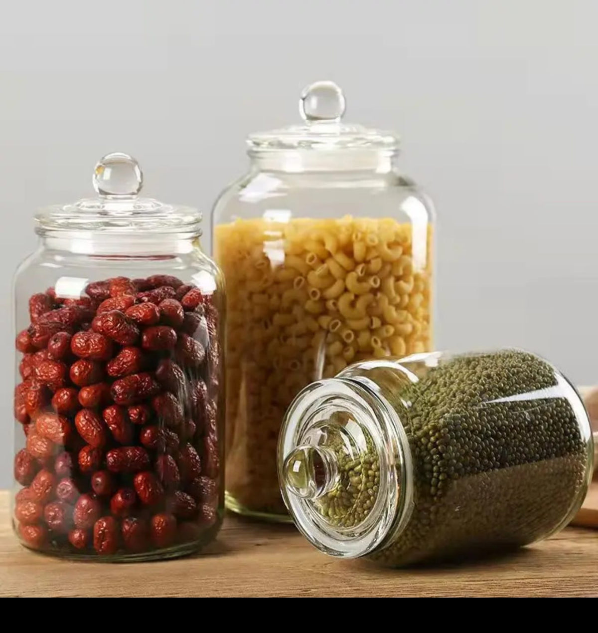 Clear acrylic storage jars with airtight knob lids available in 1.5 litre 3.2 litre and 6 litre sizes for rice pasta cereals flour beans and pantry storage.