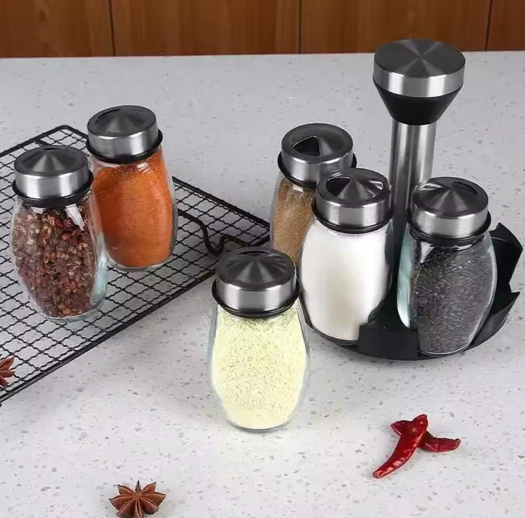 7-in-1 rotating glass spice bottle set with 150ml bottles and metallic lids in silver for organising spices, herbs, salt, pepper, and seasonings.