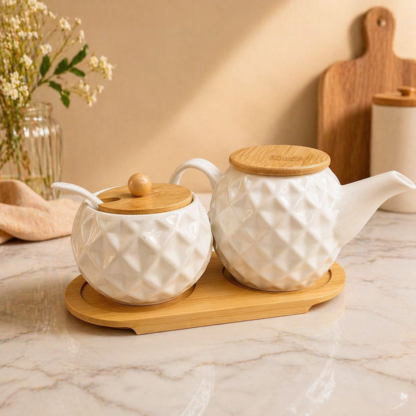 3 piece ceramic tea set with textured kettle, sugar dish and wooden lids for elegant tea serving and kitchen décor
