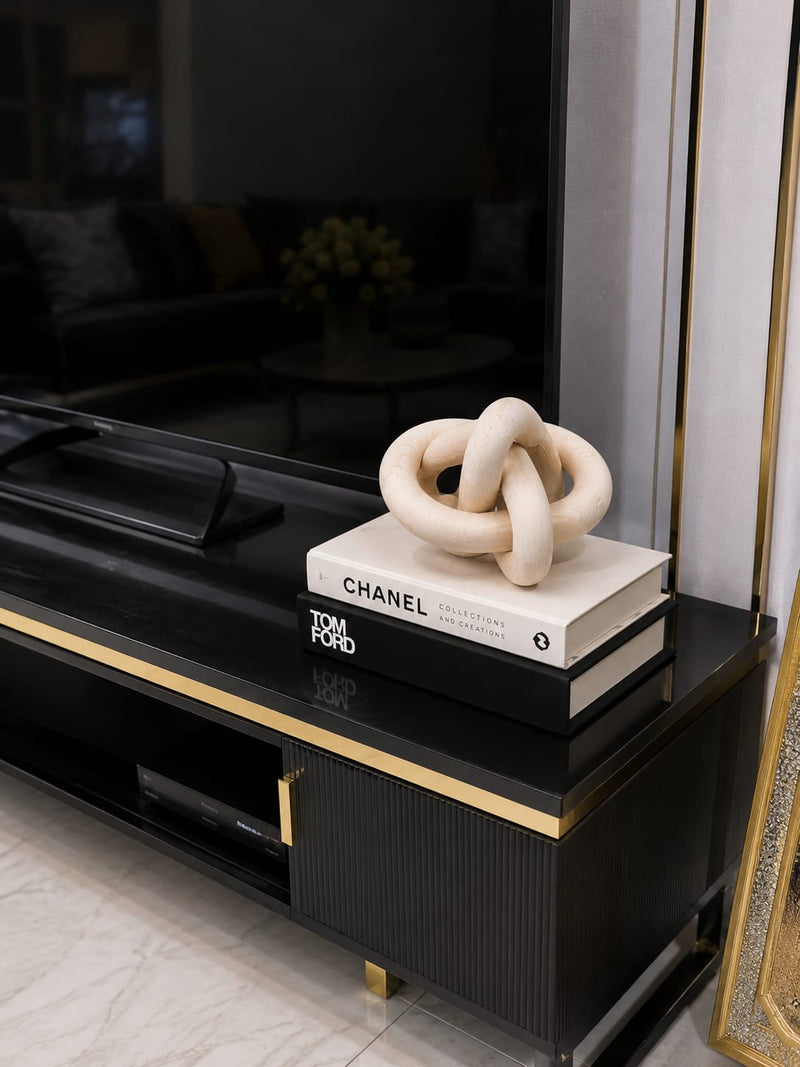 Gemelli Collections natural pine wooden knot ornament featuring an interlocking sculptural design with visible wood grain,
