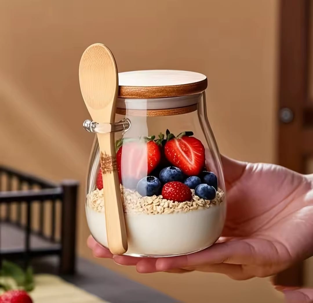 1000ml glass storage canister with airtight lid and bamboo spoon for storing and organising dry foods, cereals, sugar, coffee, tea, and kitchen ingredients
