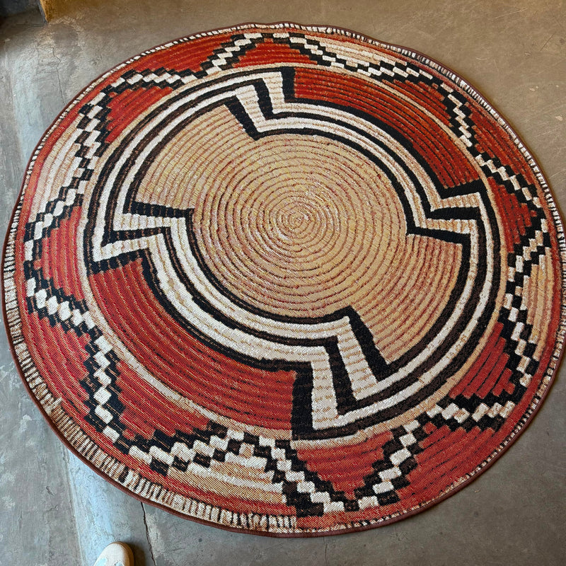 
Oriental Weavers Isla round tribal basket weave rug in terracotta, beige, black, and cream for indoor and outdoor spaces.