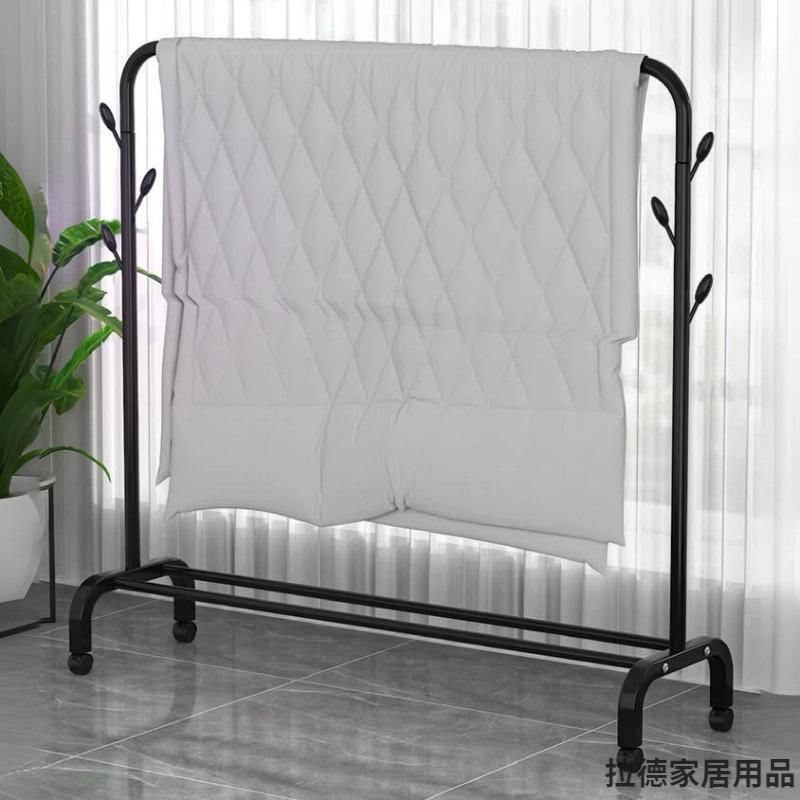 Single pole standing clothes drying rack with lower shoe rack metal garment organiser for bedroom balcony laundry room and indoor clothes storage.