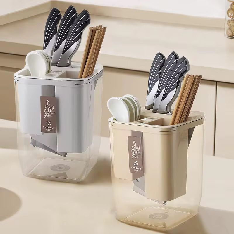 Cutlery organiser storage tray with multiple compartments for neatly organising spoons forks knives and kitchen utensils in drawers