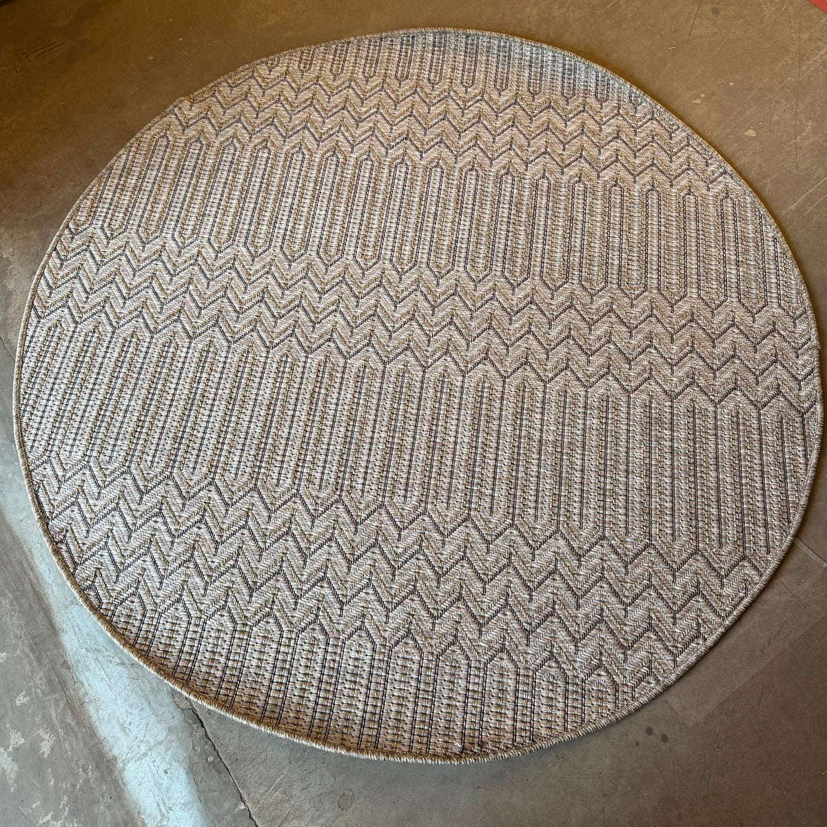 Oriental Weavers Oria round chevron flat weave rug in beige, taupe, and black polypropylene with geometric pattern.