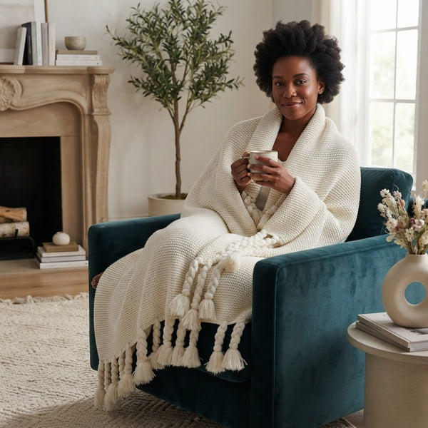 Chunky knitted throw blanket available in grey, mint green, pink, and beige for sofas, beds, lounge chairs, and cosy home décor.