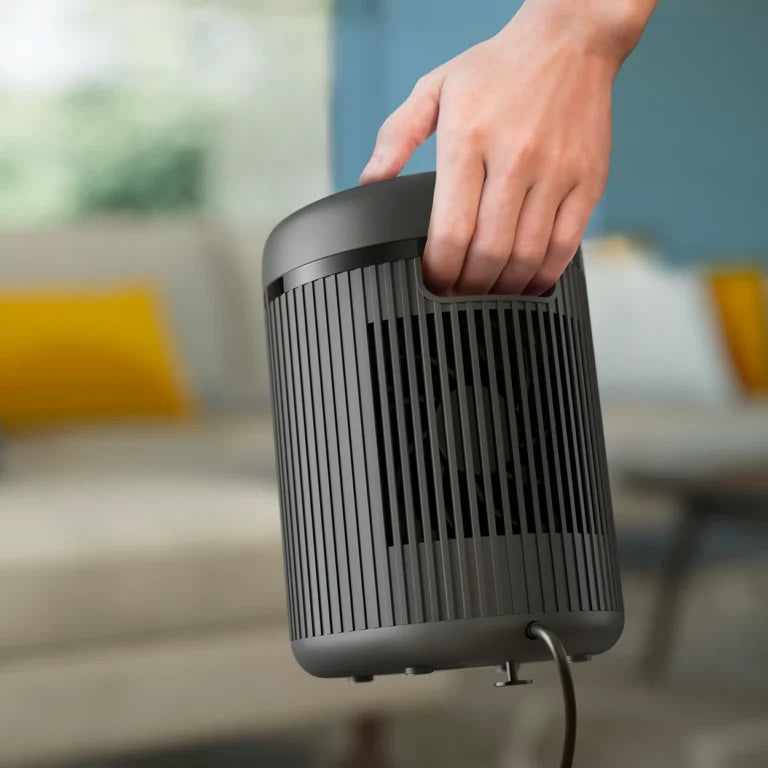 Philips 2000 Series CX2120/01 compact ceramic heater with ultra-quiet operation, touch controls, portable design, and rapid 1500W heating for small spaces.