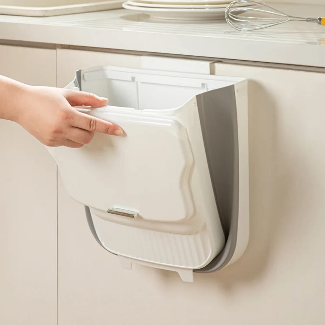 White collapsible wall-mounted trash bin for space-saving kitchen and home waste disposal, available in Nairobi, Kenya