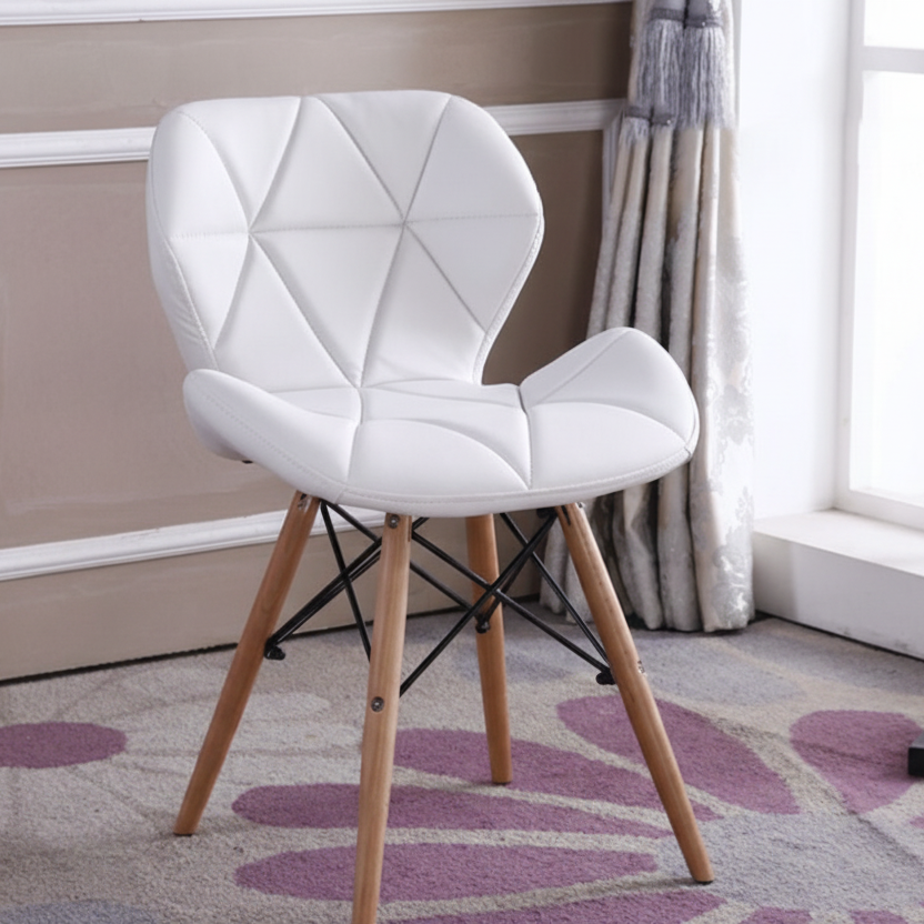 White faux leather Eames-style dining chair with padded seat, geometric stitched backrest and beech wood legs, available in Nairobi, Kenya