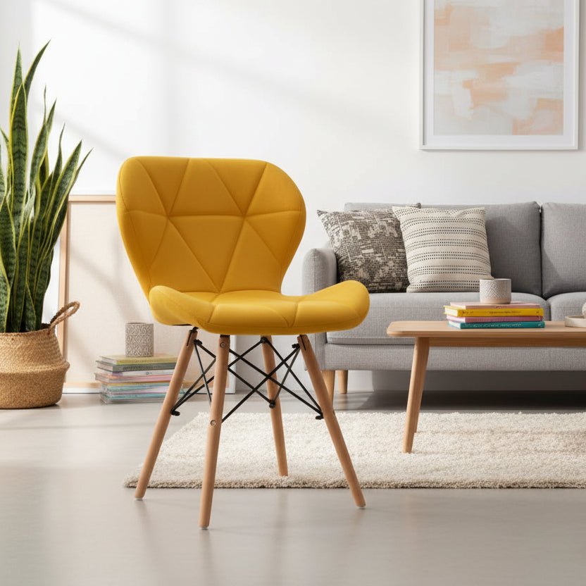Yellow faux leather Eames-style dining chair with padded seat, geometric stitched backrest and beech wood legs, available in Nairobi, Kenya