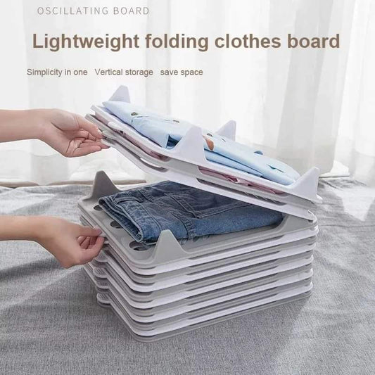 Creative clothes folding board