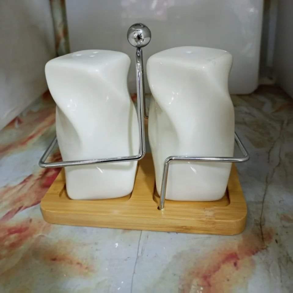 Ceramic salt/ pepper shakers set with a stand